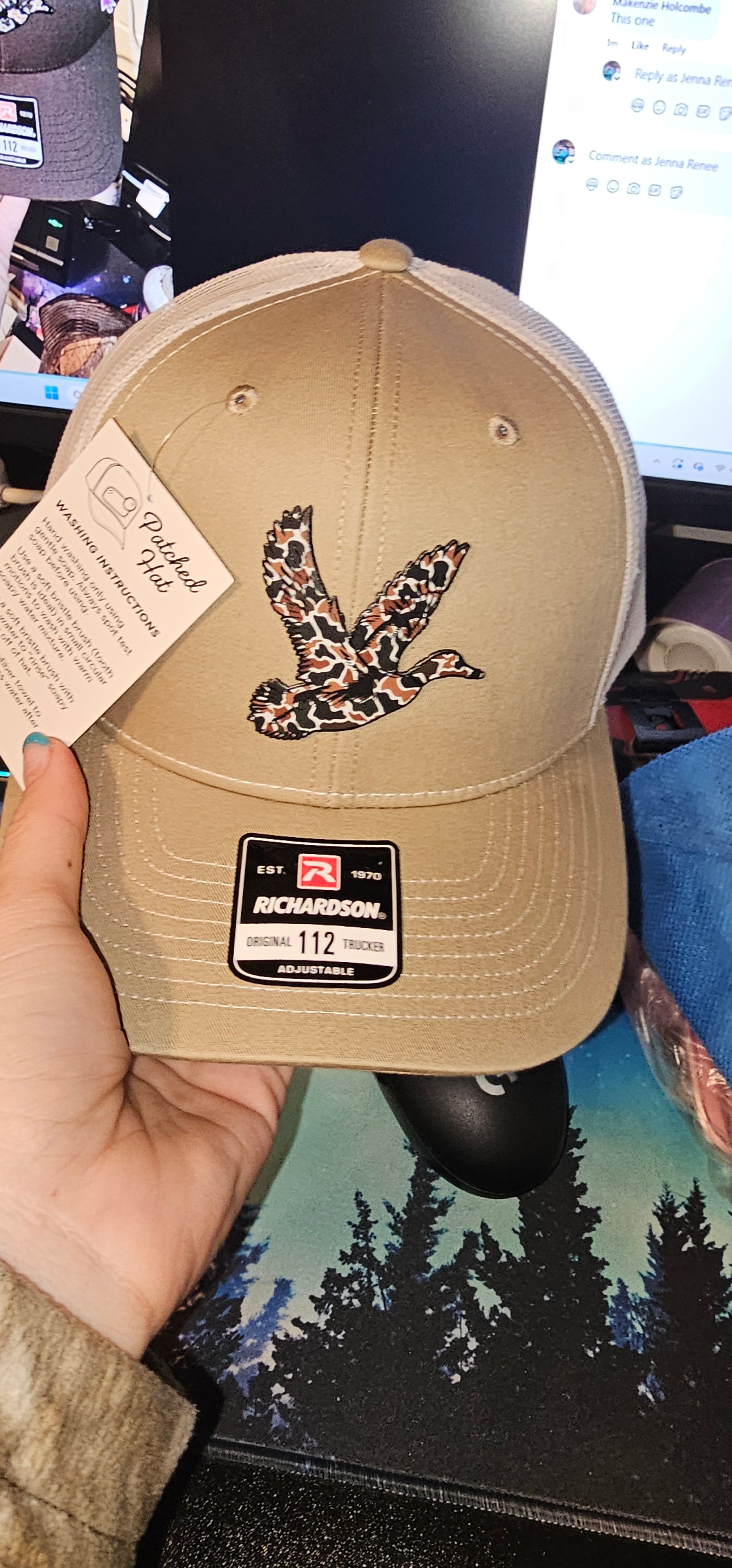Beige richardson hat with a camo bird patch